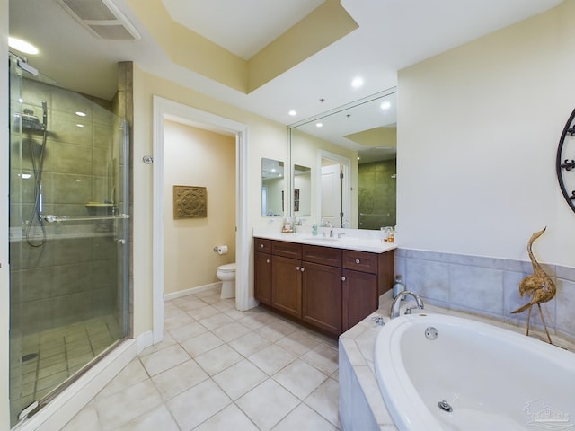 full bathroom featuring a stall shower, toilet, vanity, and a garden tub