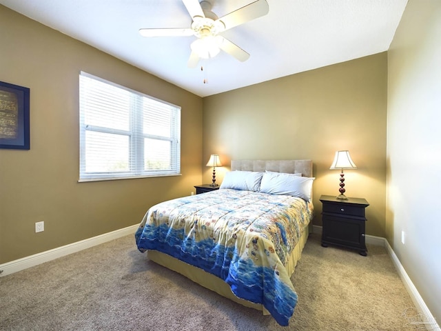 bedroom with light carpet, ceiling fan, and baseboards