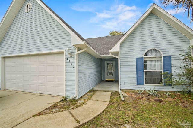 view of front of property with a garage