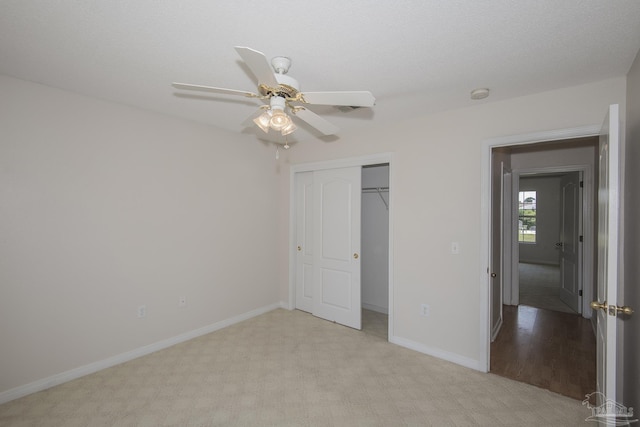 3221 Cobblestone Dr, Pace, FL 32571 - unfurnished bedroom featuring light carpet, a closet, baseboards, and ceiling fan
