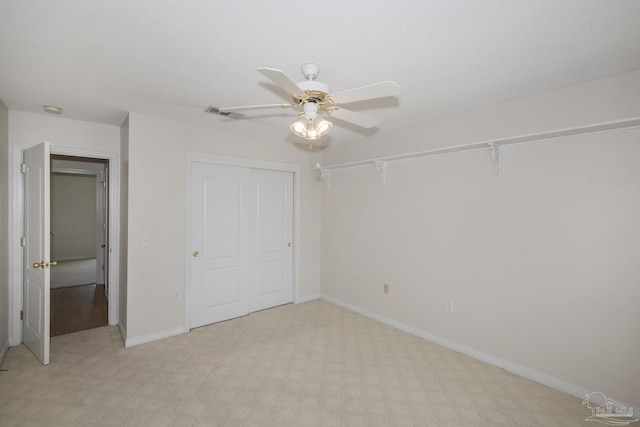 3221 Cobblestone Dr, Pace, FL 32571 - unfurnished bedroom with a closet, light colored carpet, baseboards, and ceiling fan