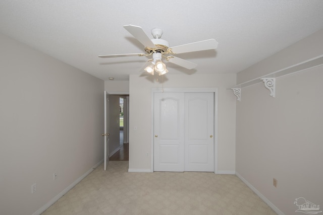 3221 Cobblestone Dr, Pace, FL 32571 - unfurnished bedroom with a closet, baseboards, a ceiling fan, and light colored carpet