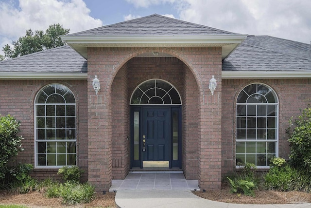 3221 Cobblestone Dr, Pace, FL 32571 - entrance to property featuring a shingled roof and brick siding