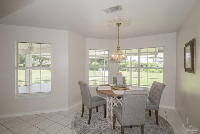 3221 Cobblestone Dr, Pace, FL 32571 - dining area with plenty of natural light, light tile patterned flooring, and baseboards
