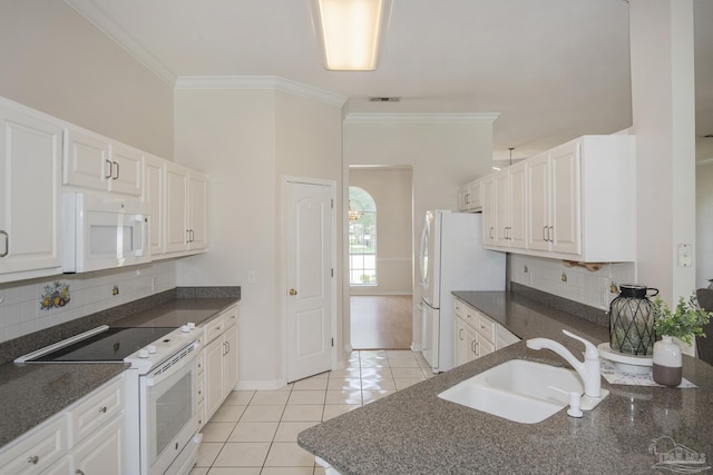 3221 Cobblestone Dr, Pace, FL 32571 - kitchen with white appliances, a sink, crown molding, light tile patterned flooring, and white cabinetry
