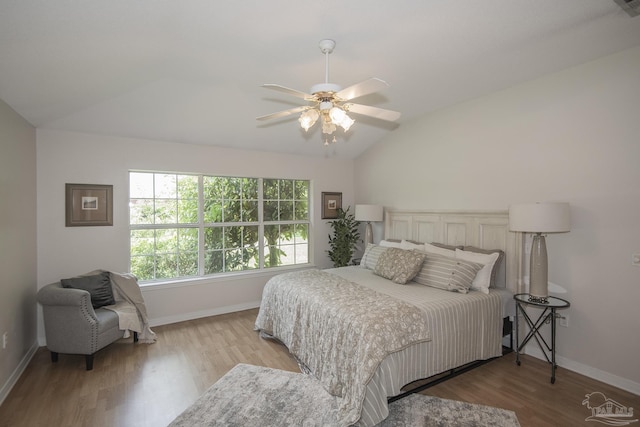 3221 Cobblestone Dr, Pace, FL 32571 - bedroom with lofted ceiling, wood finished floors, baseboards, and ceiling fan