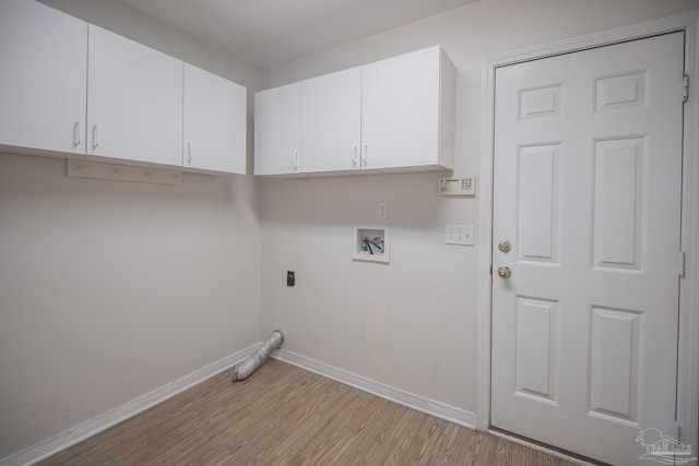 3221 Cobblestone Dr, Pace, FL 32571 - laundry area with hookup for a washing machine, baseboards, light wood-style flooring, cabinet space, and hookup for an electric dryer