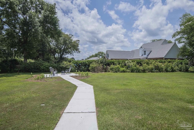 3221 Cobblestone Dr, Pace, FL 32571 - view of green lawn featuring a patio area