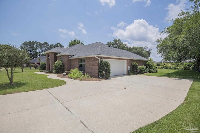 3221 Cobblestone Dr, Pace, FL 32571 - view of home's exterior featuring brick siding, a yard, a garage, concrete driveway, and a shingled roof