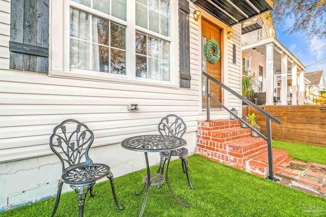 doorway to property with fence