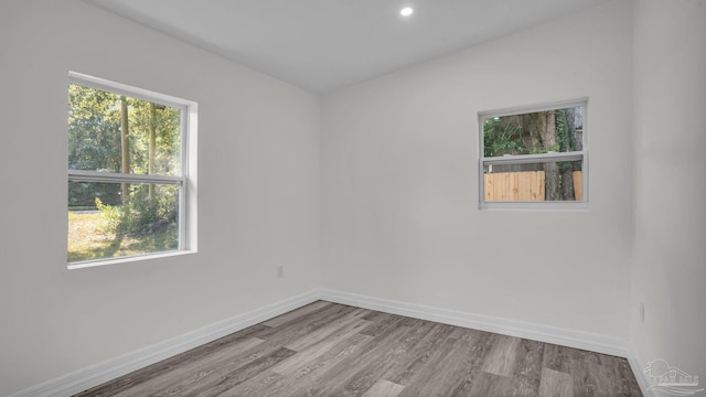 spare room featuring light hardwood / wood-style flooring