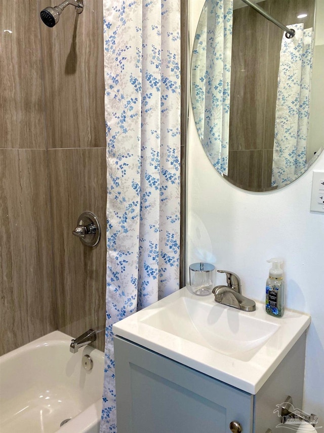 bathroom with vanity and shower / bath combo