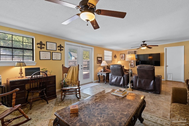 living room with baseboards, a ceiling fan, ornamental molding, a textured ceiling, and french doors