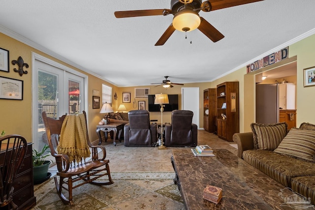 living area featuring a textured ceiling, ornamental molding, and baseboards