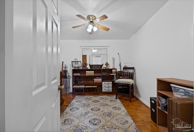 office with a ceiling fan and baseboards