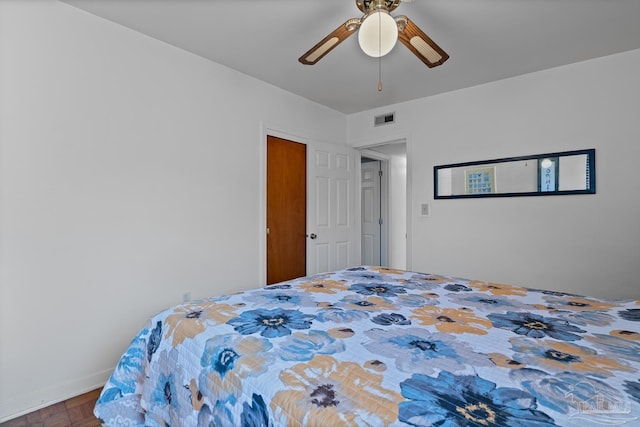 bedroom with visible vents, ceiling fan, and baseboards