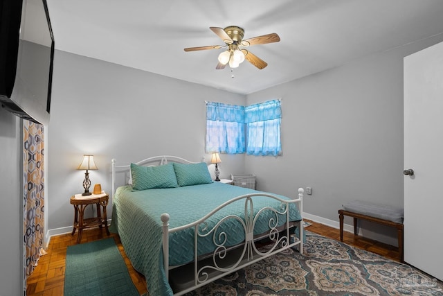 bedroom featuring baseboards and a ceiling fan