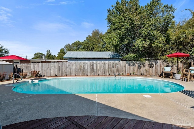 view of pool with a fenced in pool, a patio area, and a fenced backyard