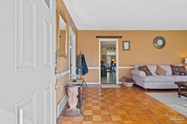 foyer entrance featuring baseboards