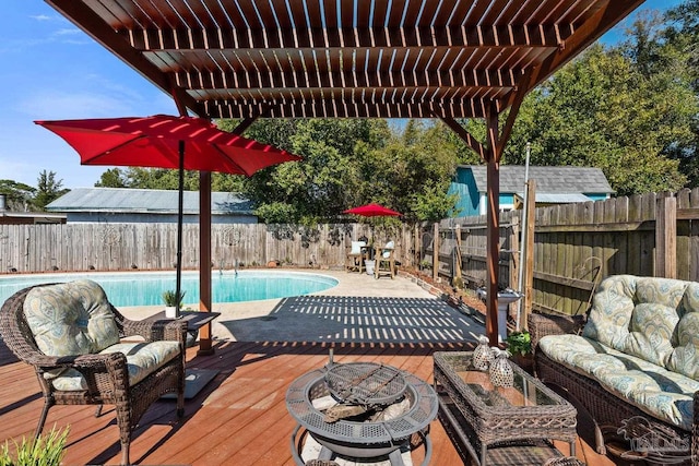 wooden terrace with a fenced in pool, outdoor lounge area, a fenced backyard, and a pergola