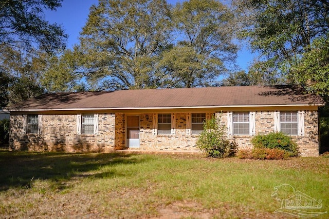 ranch-style home with a front lawn