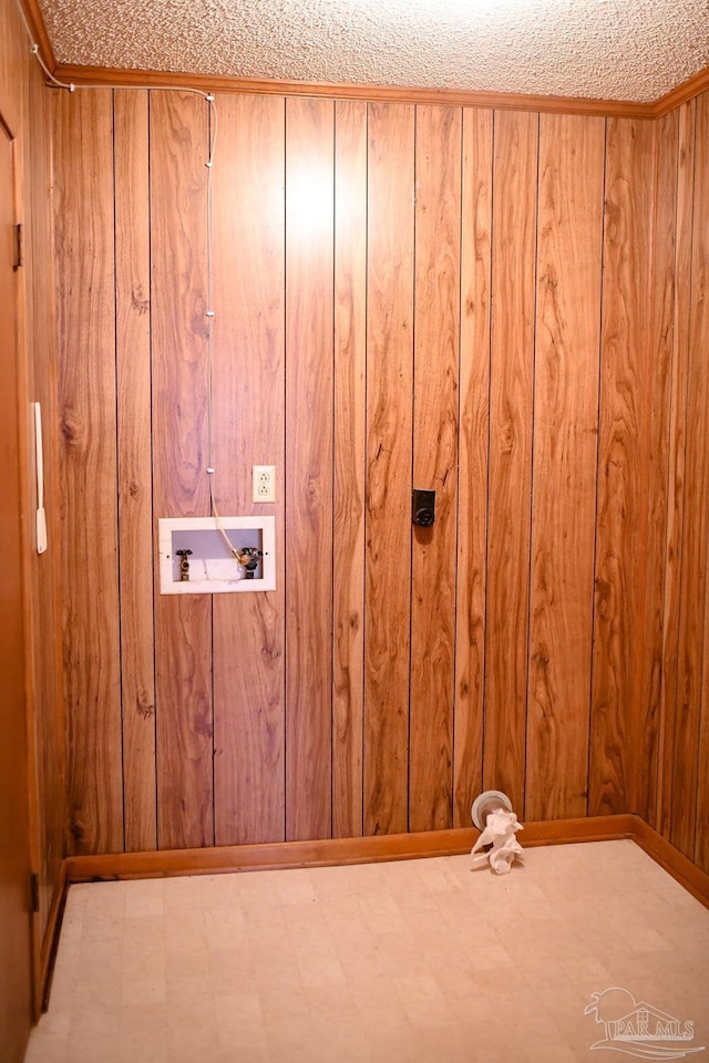 washroom with wood walls and washer hookup