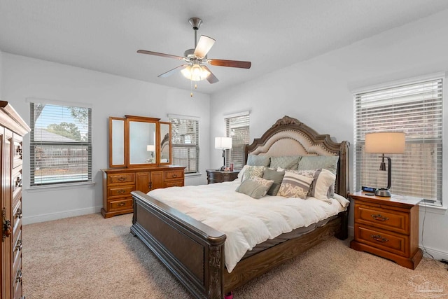 bedroom with baseboards, light colored carpet, and ceiling fan