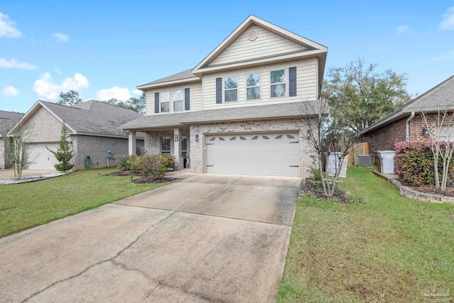 traditional home featuring a front lawn, a garage, brick siding, and driveway