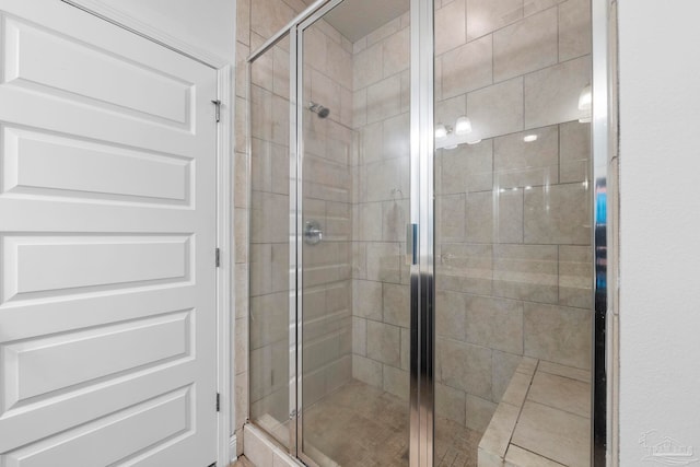 full bath featuring a shower stall