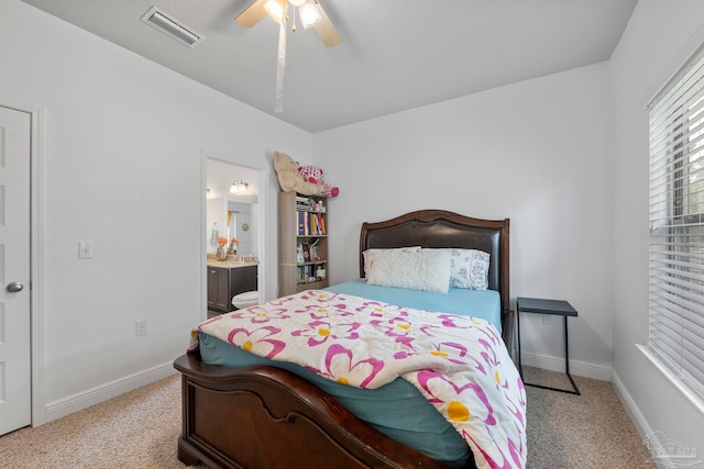 bedroom with visible vents, light carpet, and baseboards