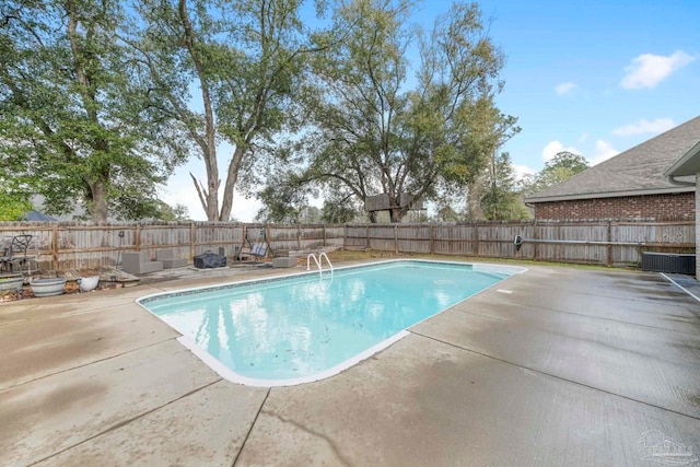 view of swimming pool featuring a patio area, a fenced in pool, and a fenced backyard