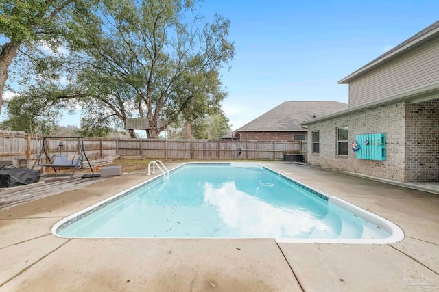 view of swimming pool with a patio, a fenced backyard, and a fenced in pool