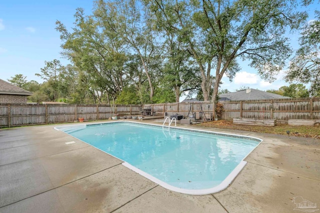 view of pool featuring a fenced in pool, a patio, and a fenced backyard