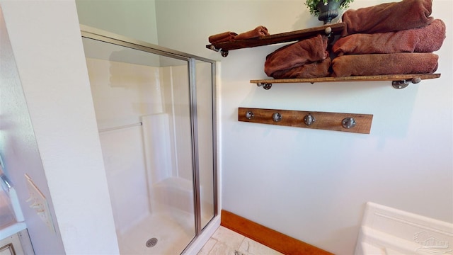 bathroom with tile patterned flooring and an enclosed shower