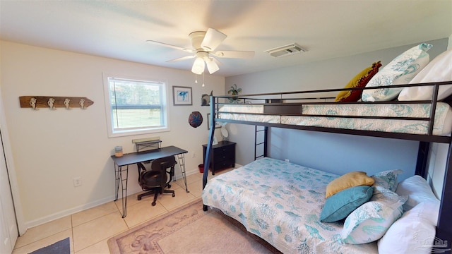 bedroom with light tile patterned floors and ceiling fan