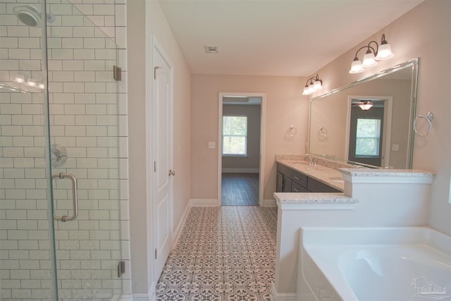 bathroom with tile patterned floors, a bath, visible vents, baseboards, and a shower stall