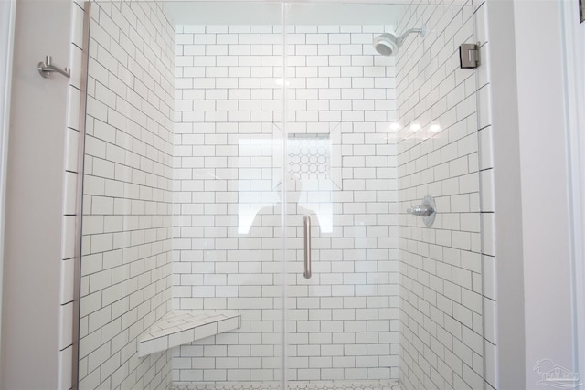 bathroom featuring a shower stall