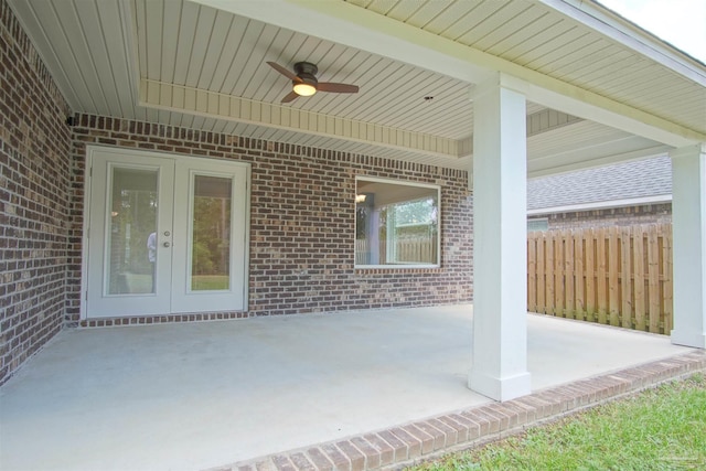 view of patio featuring french doors, ceiling fan, and fence