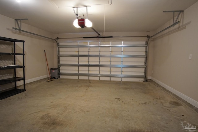 garage featuring baseboards and a garage door opener