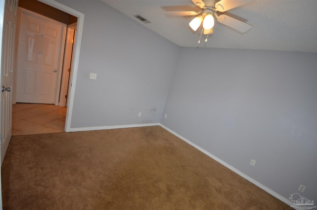 spare room featuring baseboards, ceiling fan, carpet flooring, and visible vents
