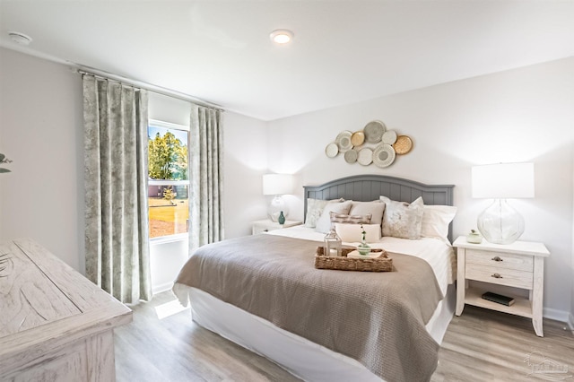 bedroom with light hardwood / wood-style floors