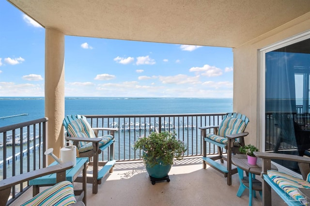 balcony featuring a water view