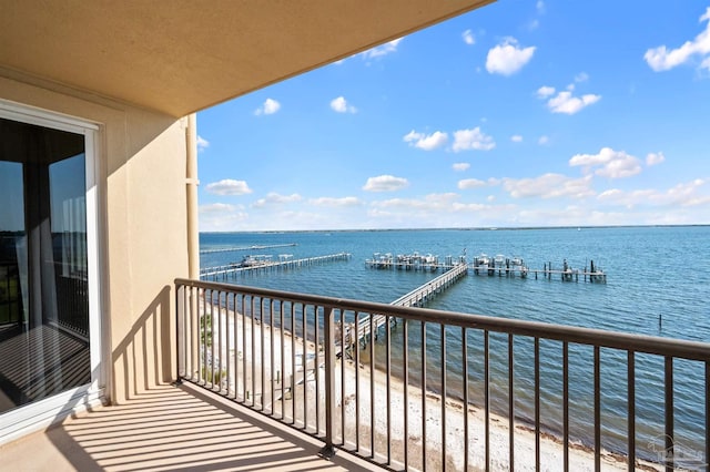 balcony featuring a water view