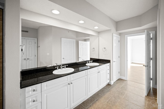 bathroom featuring tile patterned floors and vanity