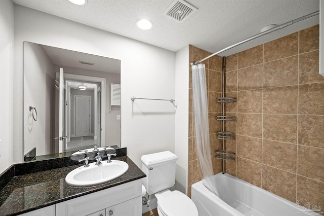 full bathroom featuring shower / bathtub combination with curtain, vanity, a textured ceiling, and toilet