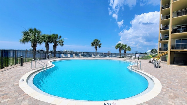 view of pool featuring a patio area