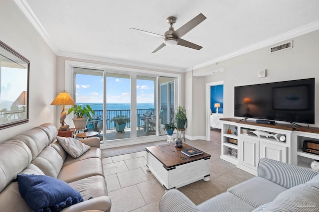 tiled living room with ceiling fan and ornamental molding