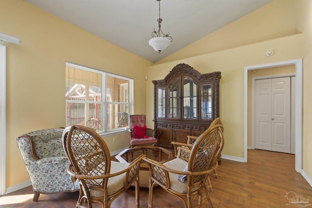 sitting room featuring hardwood / wood-style flooring and vaulted ceiling