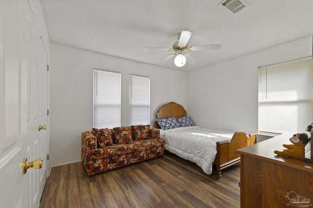 bedroom featuring ceiling fan and dark hardwood / wood-style floors