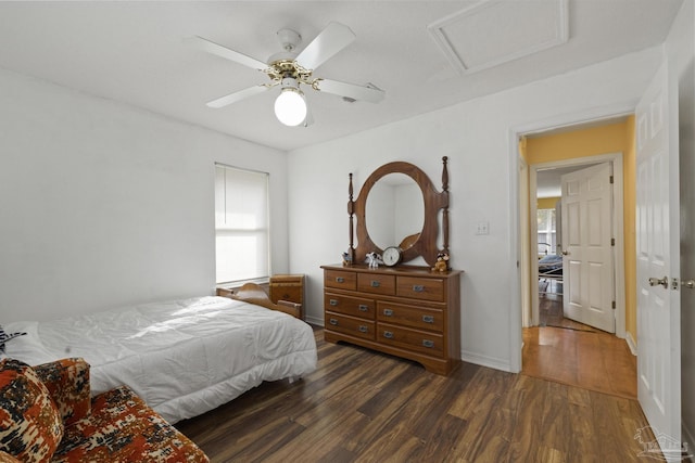 bedroom with dark hardwood / wood-style floors and ceiling fan